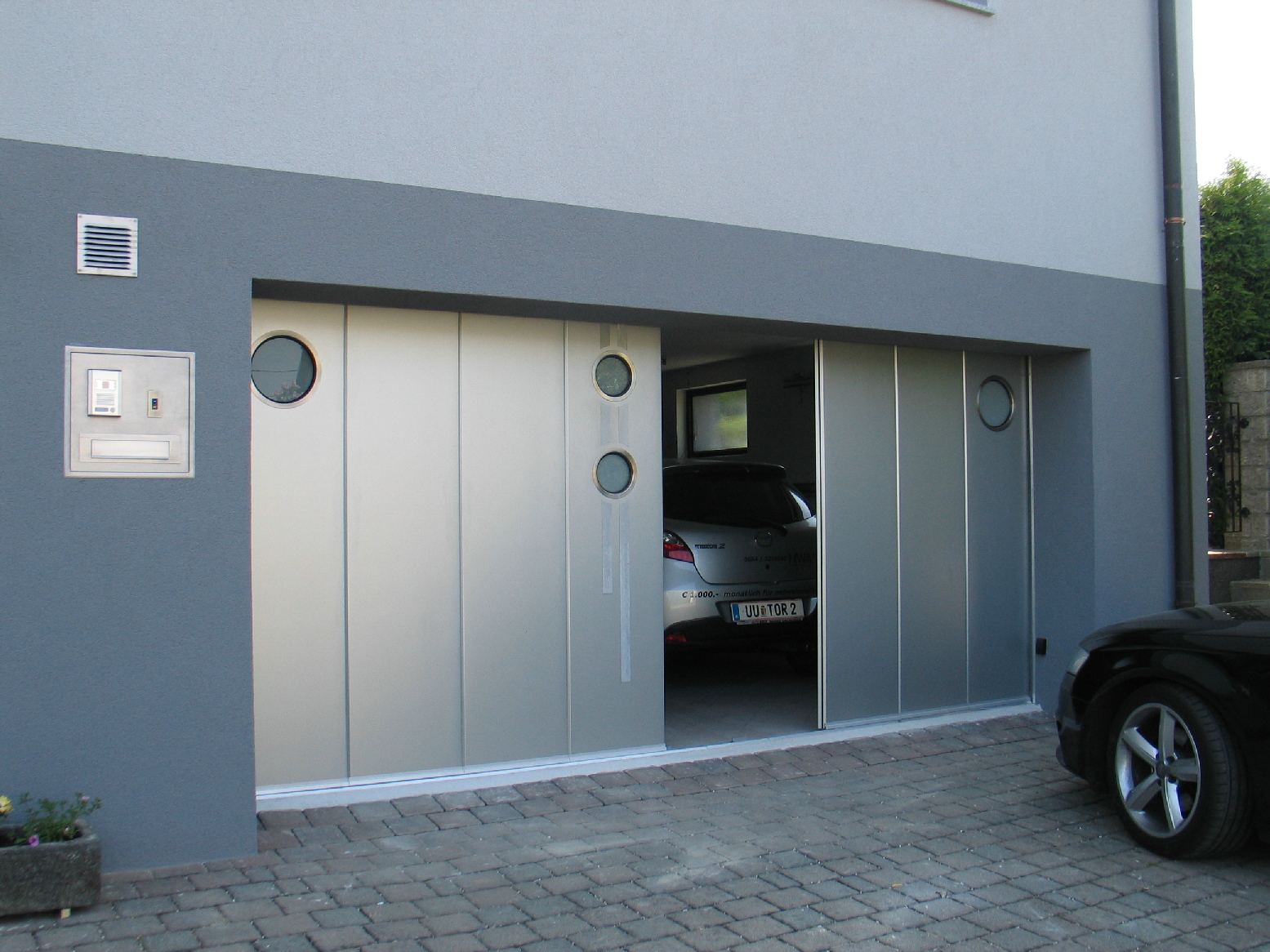 Side sliding garage doors
